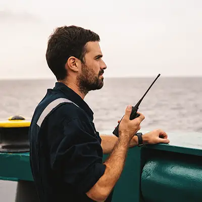 person on boat with radio